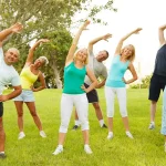 A group of people exercising outdoors