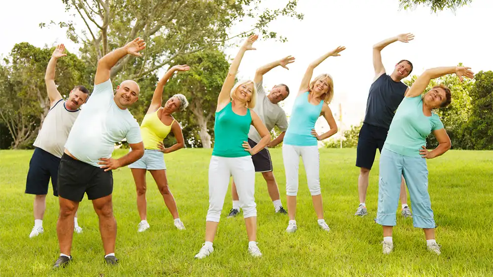 A group of people exercising outdoors